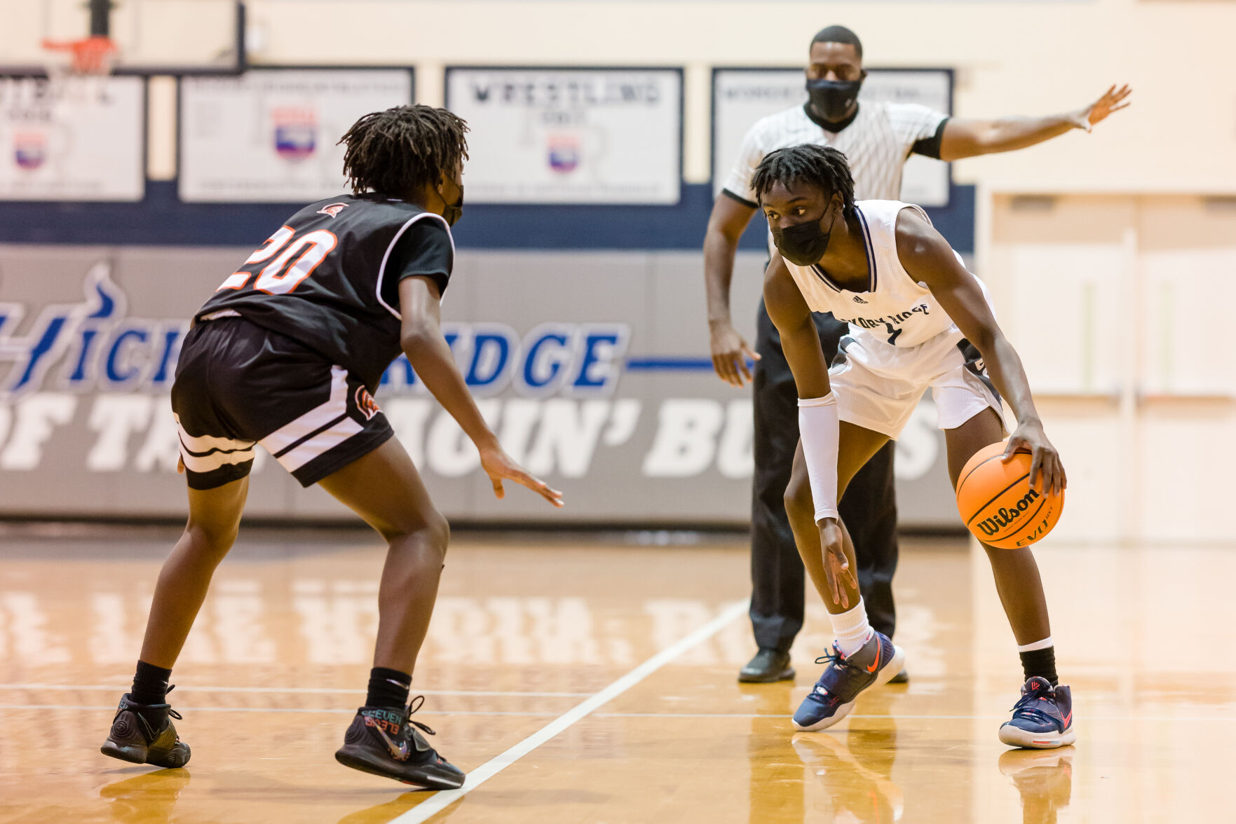 Boys Basketball: Hickory Ridge RaginÕ Bulls defeated the Northwest Cabarrus Trojans 64-56.